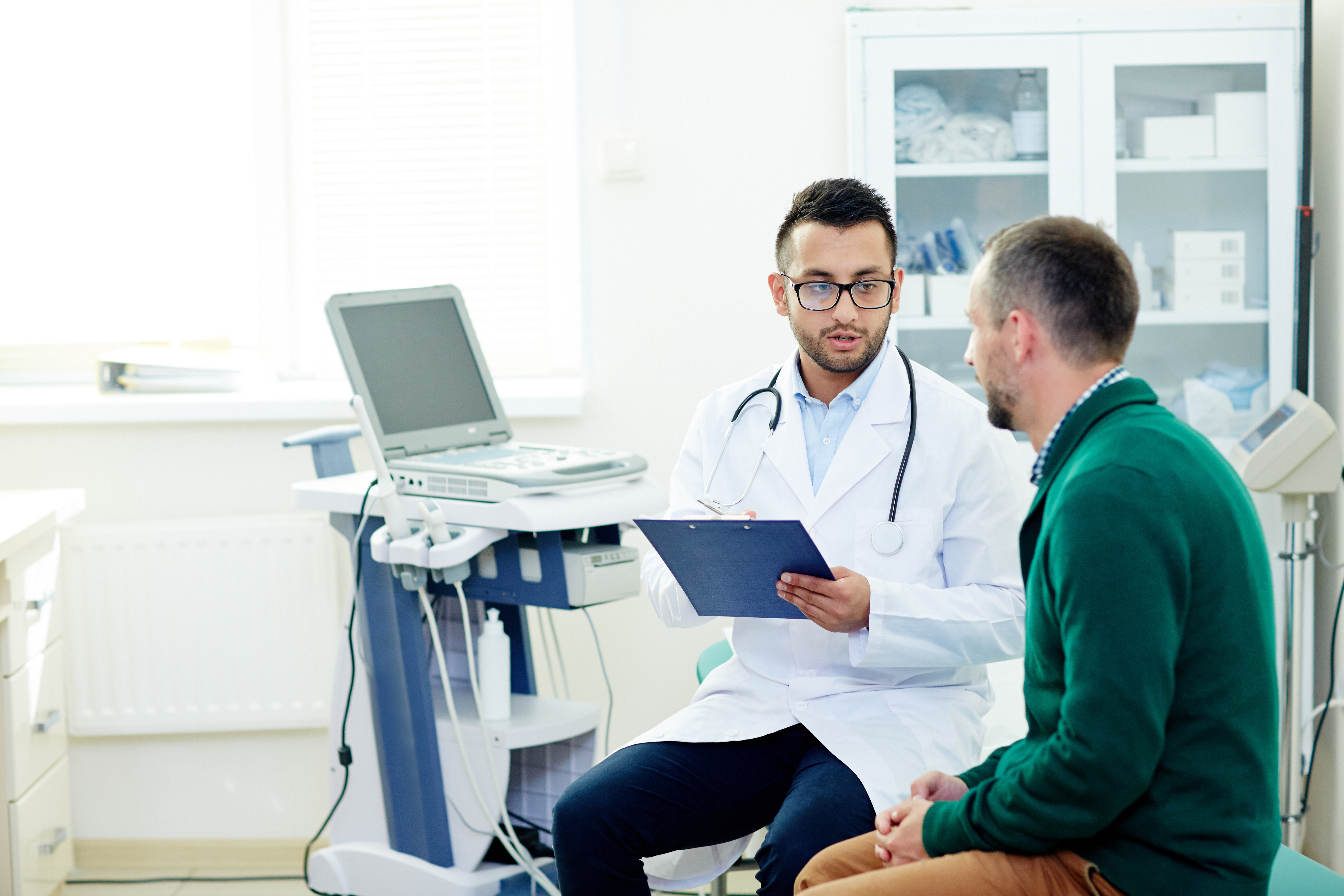 doctor speaking with patient